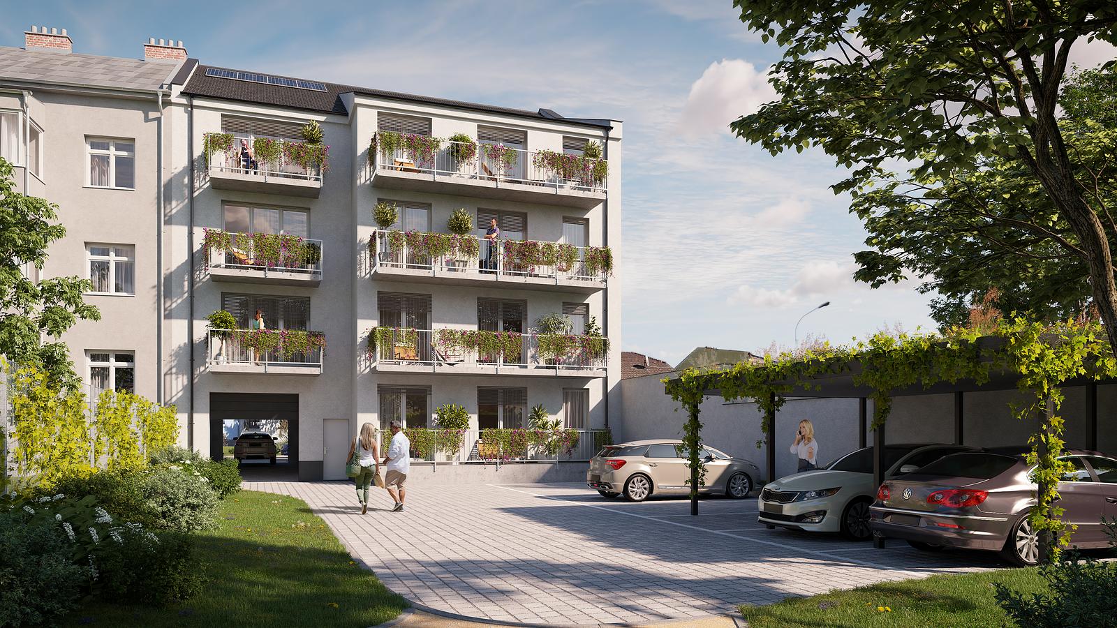 Vnitroblok bytového domu KŠÍROVA lofts s venkovními parkovacími stáními a zeleným přístřeškem pro automobily